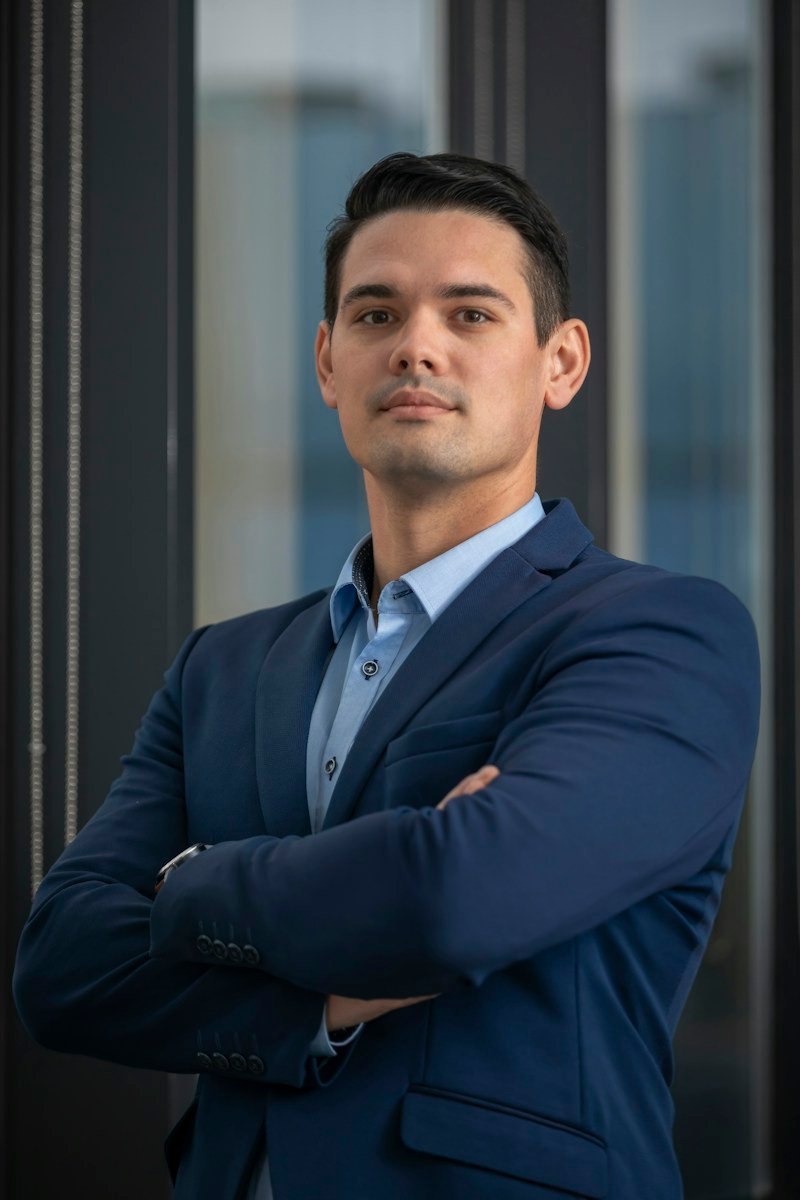 Illustrative executive portrait for Sam Chen; not an actual customer photo. Photo: Gruescu Ovidiu / Unsplash.